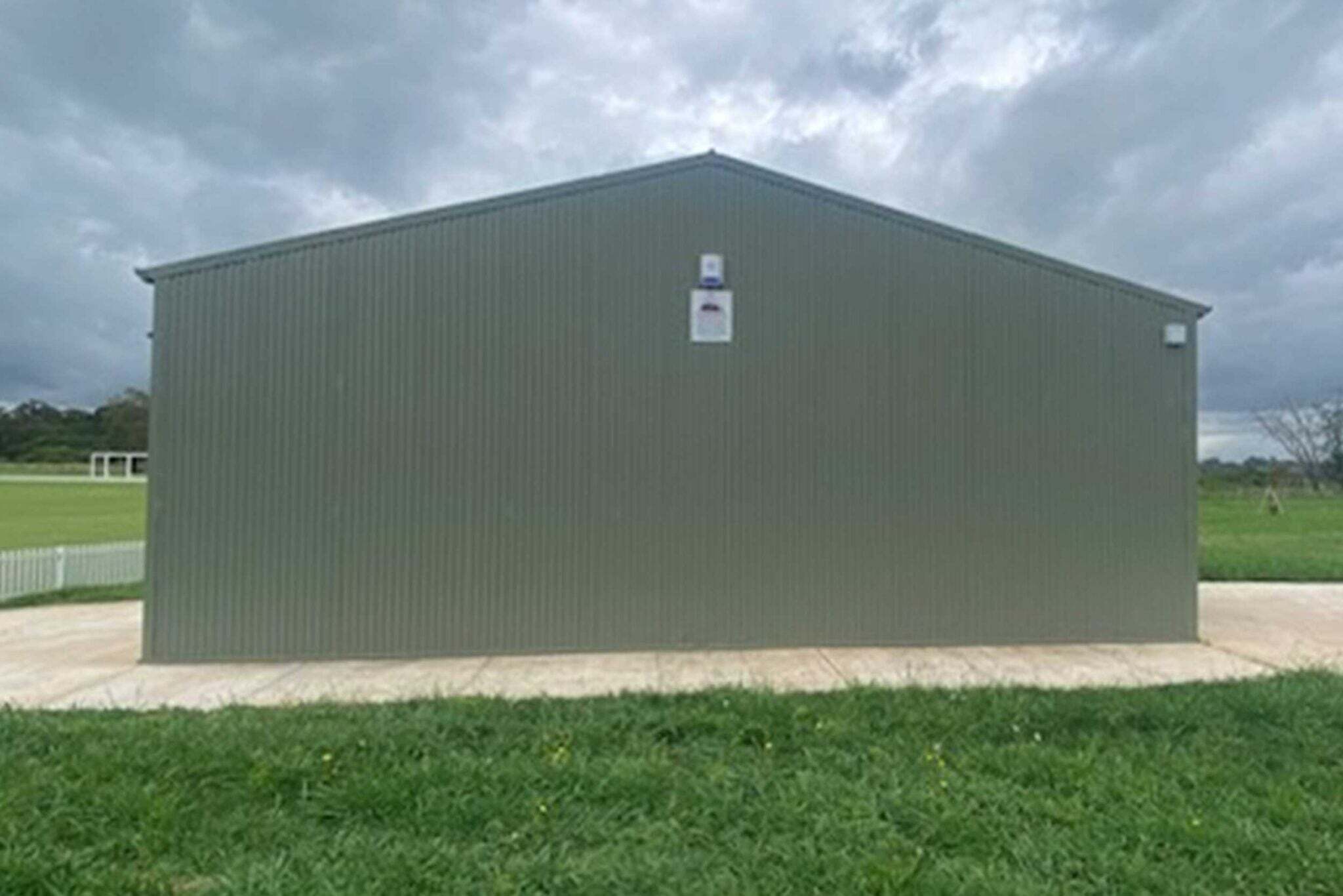 Before the mural was painted at Ferguson Cricket Grounds this was the bare shed.